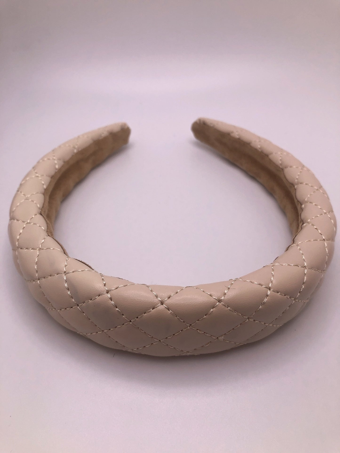 
                  
                    Faux leather headband
                  
                