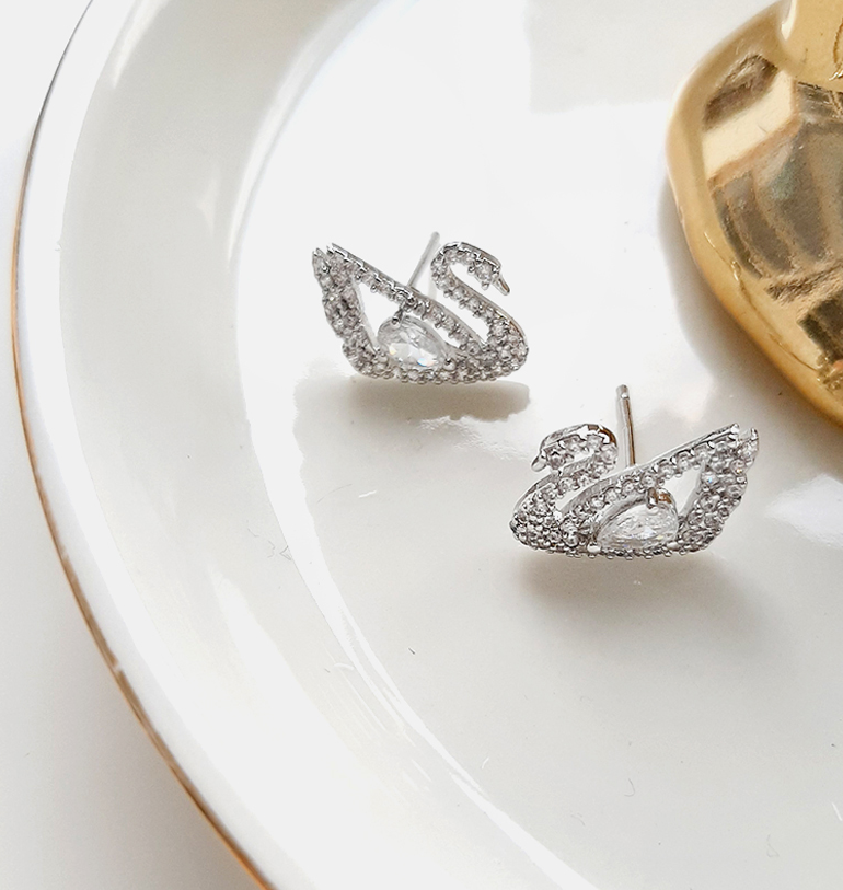 
                  
                    Silver post Swan earrings
                  
                